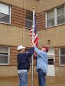 Gary and Marty raising the flag